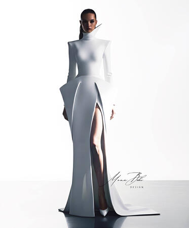 The Neoteric Project Collection More than just a dress, it's an architectural masterpiece. A style that blends purity with power, featuring sharp structural details and a futuristic high collar. A bold white design that embodies elegance in its simplest y